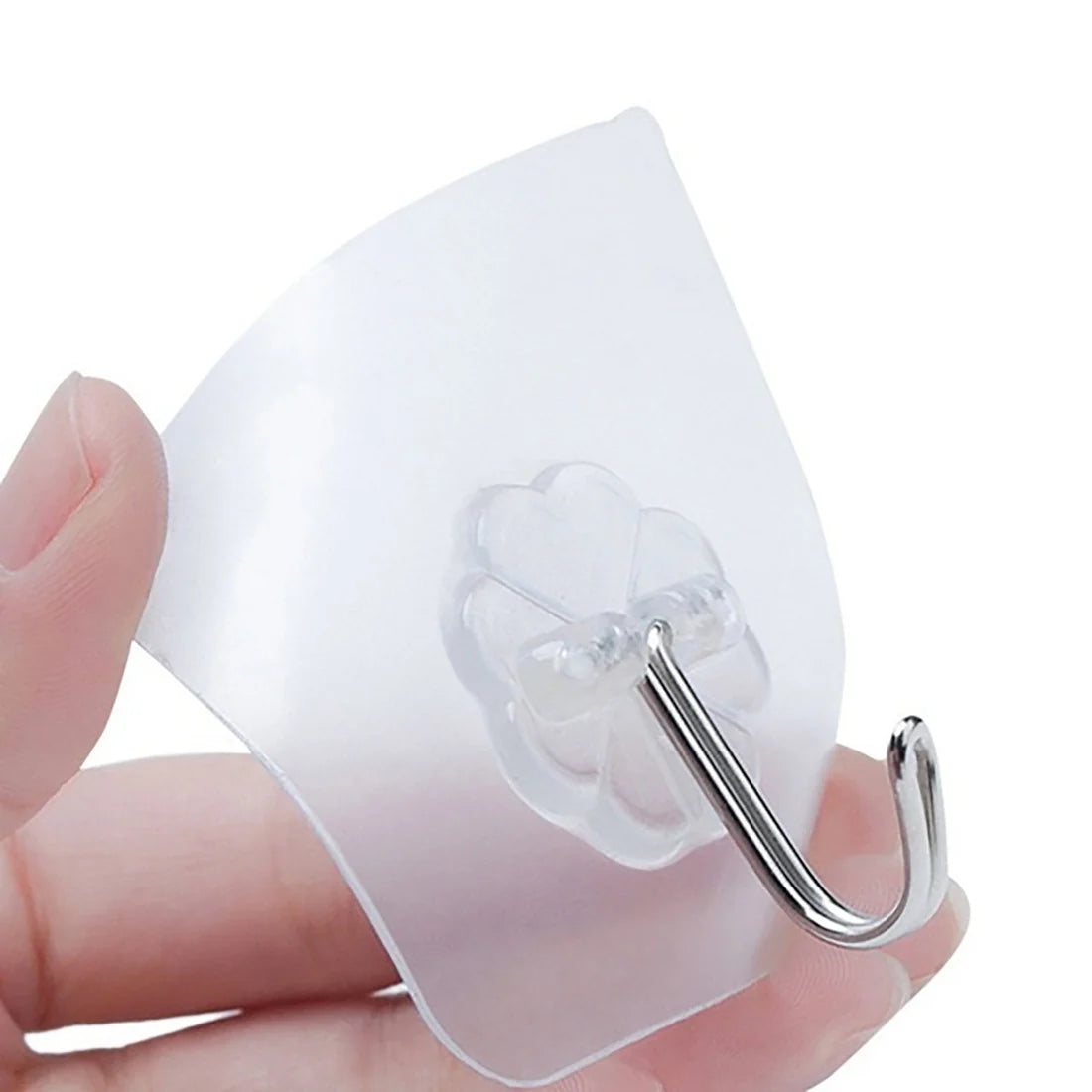 Clear adhesive hook with a metal hook on a white background